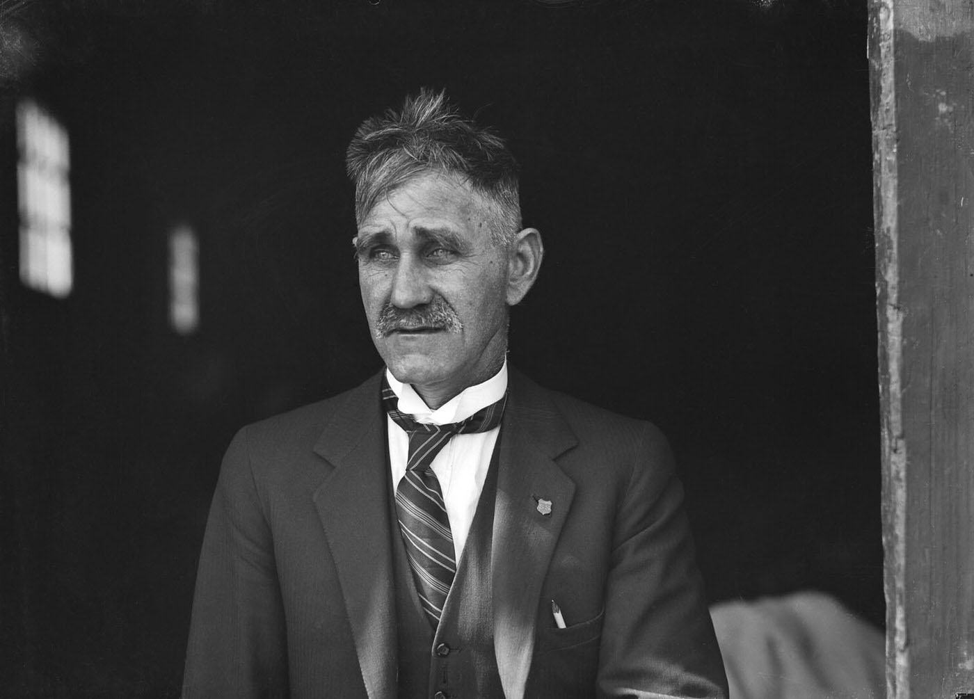 #73 Portrait of a man outside SCEGS Boatshed, Berrys Bay