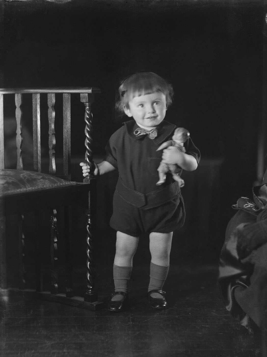 #78 Portrait of a young child with a doll