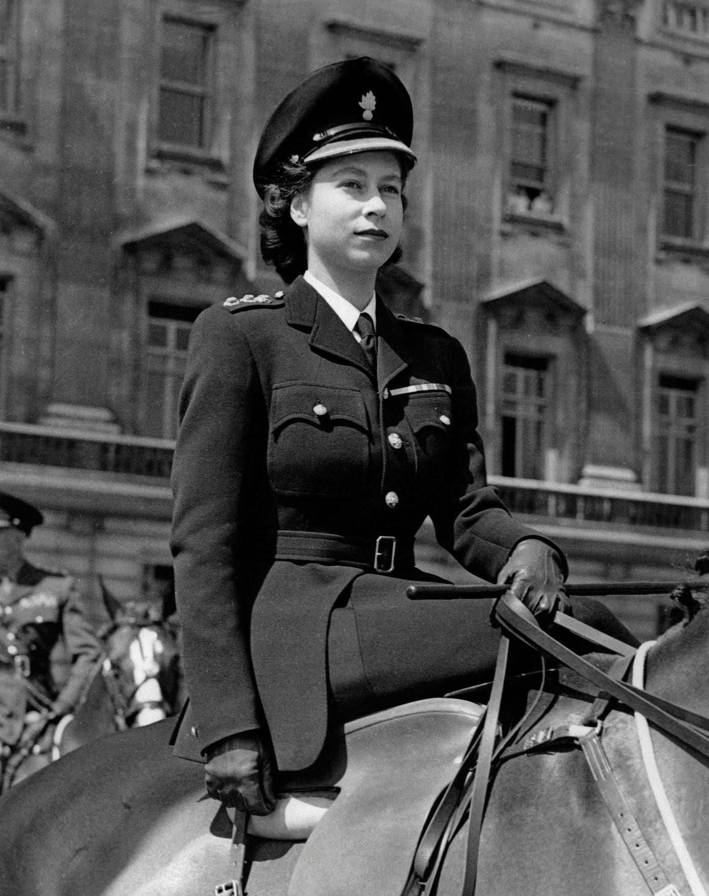 #99 Princess Elizabeth (the future Queen Elizabeth II) outside Buckingham Palace, London, England, 12 June 1947.