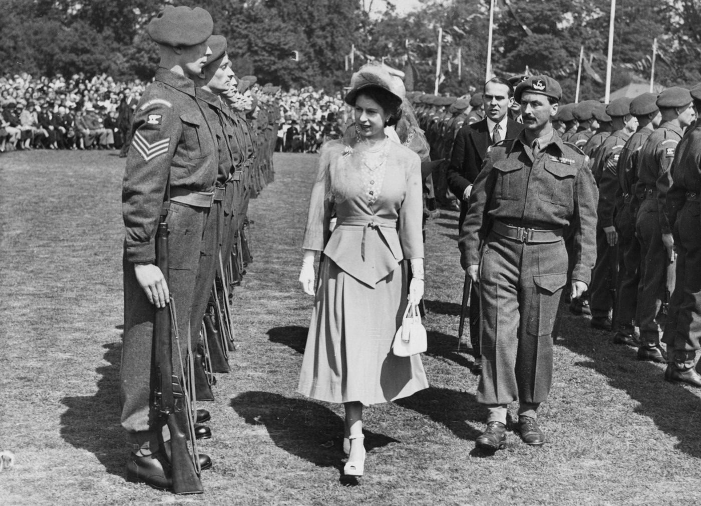 #105 Princess Elizabeth inspects a Guard of Honor of the 7th Battalion, Royal Warwickshire Regiment at the War Memorial Park in Coventry, England, 22 May 1948.