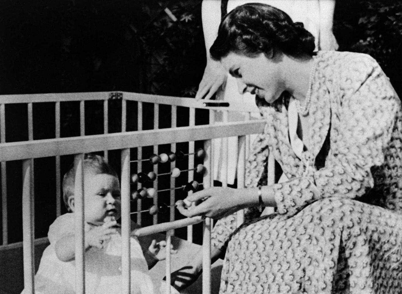 #107 Future Queen Elizabeth II of England with her baby Prince Charles, 1949.