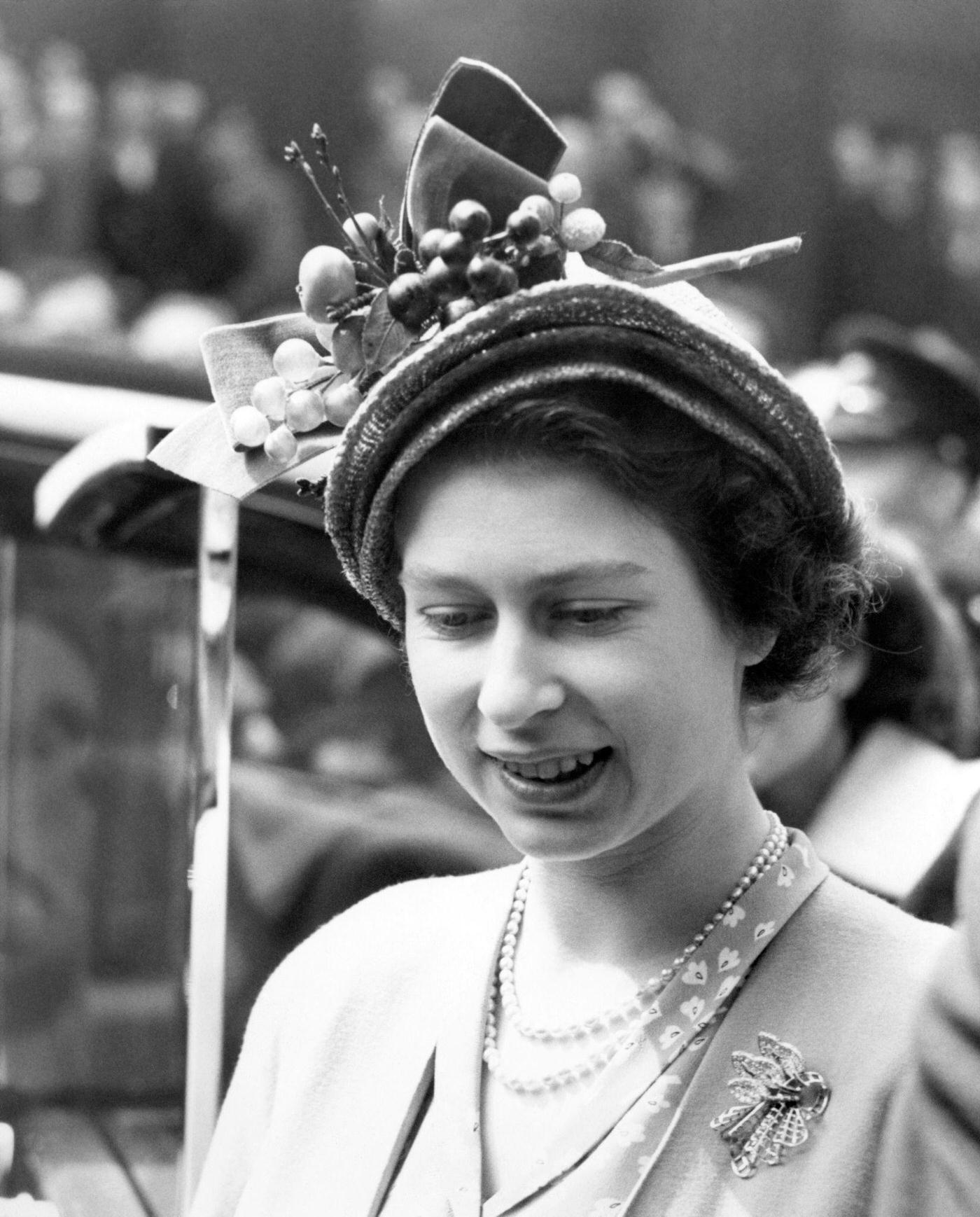 #108 Princess Elizabeth leaves the London Stock Exchange after her private visit with the Duke of Edinburgh, where they watched business being done and lunched with the Chairman and Council, London, England, 1949.