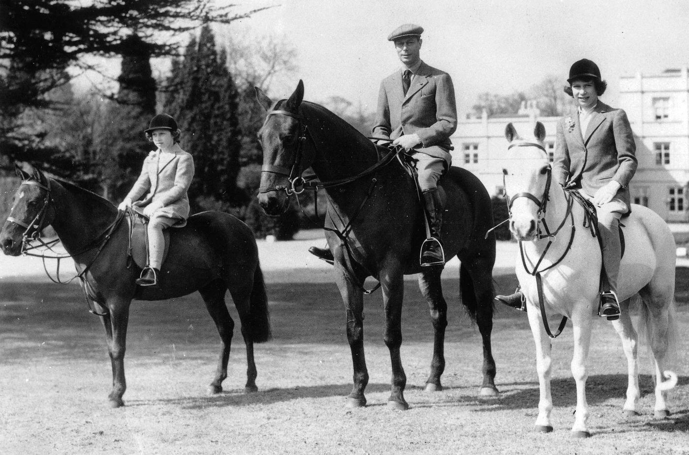 #11 King George VI out riding his horse with his daughters Princess Elizabeth, later Queen Elizabeth II, and Princess Margaret (left) in Windsor Great Park, England, 21st April, 1939.