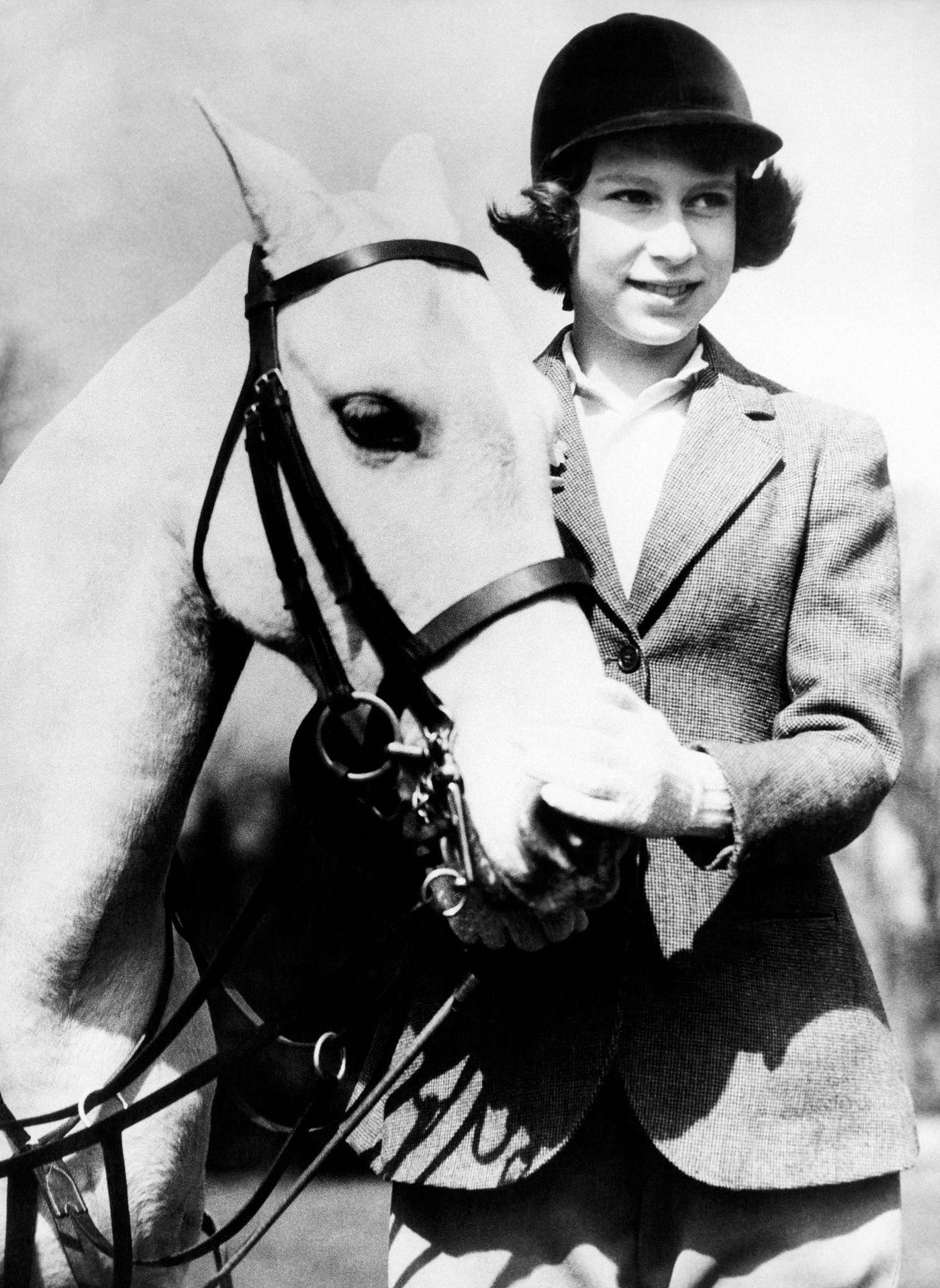 #3 Princess Elizabeth, the future Queen Elizabeth II, in Windsor Great Park with her white pony, 1939.