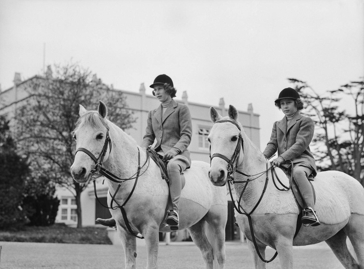 #29 The Royal Princesses Elizabeth and Margaret riding horses, UK, 1940.