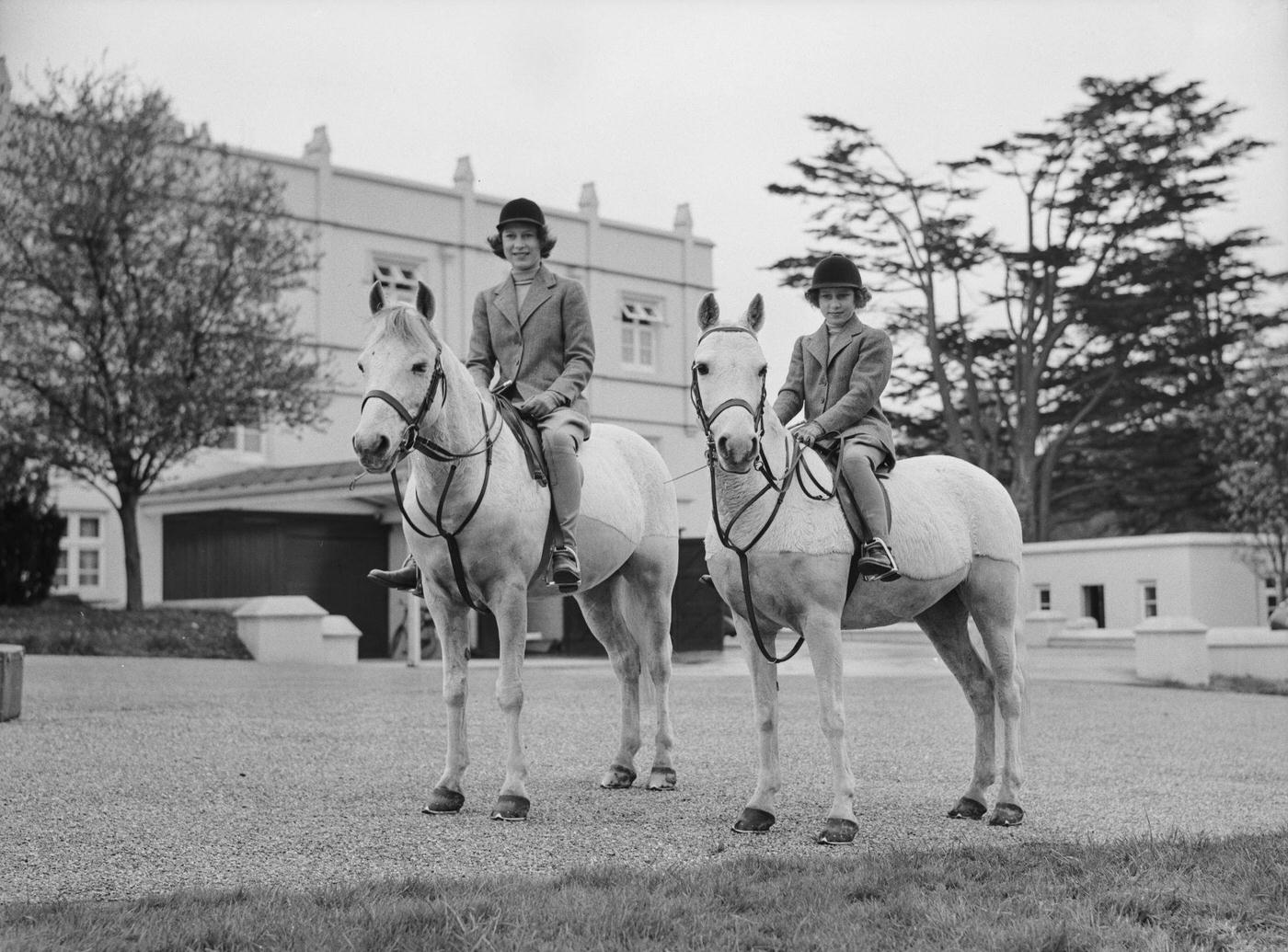 #33 The Royal Princesses Elizabeth and Margaret riding horses, UK, 1940.
