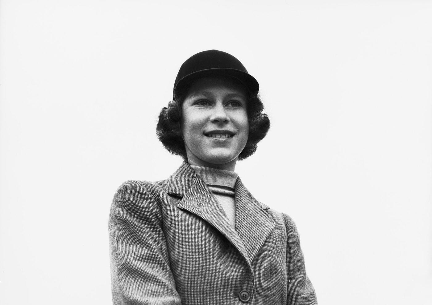 #40 Princess Elizabeth in a riding habit and riding hat, Royal Lodge, Windsor, UK, April 1940.