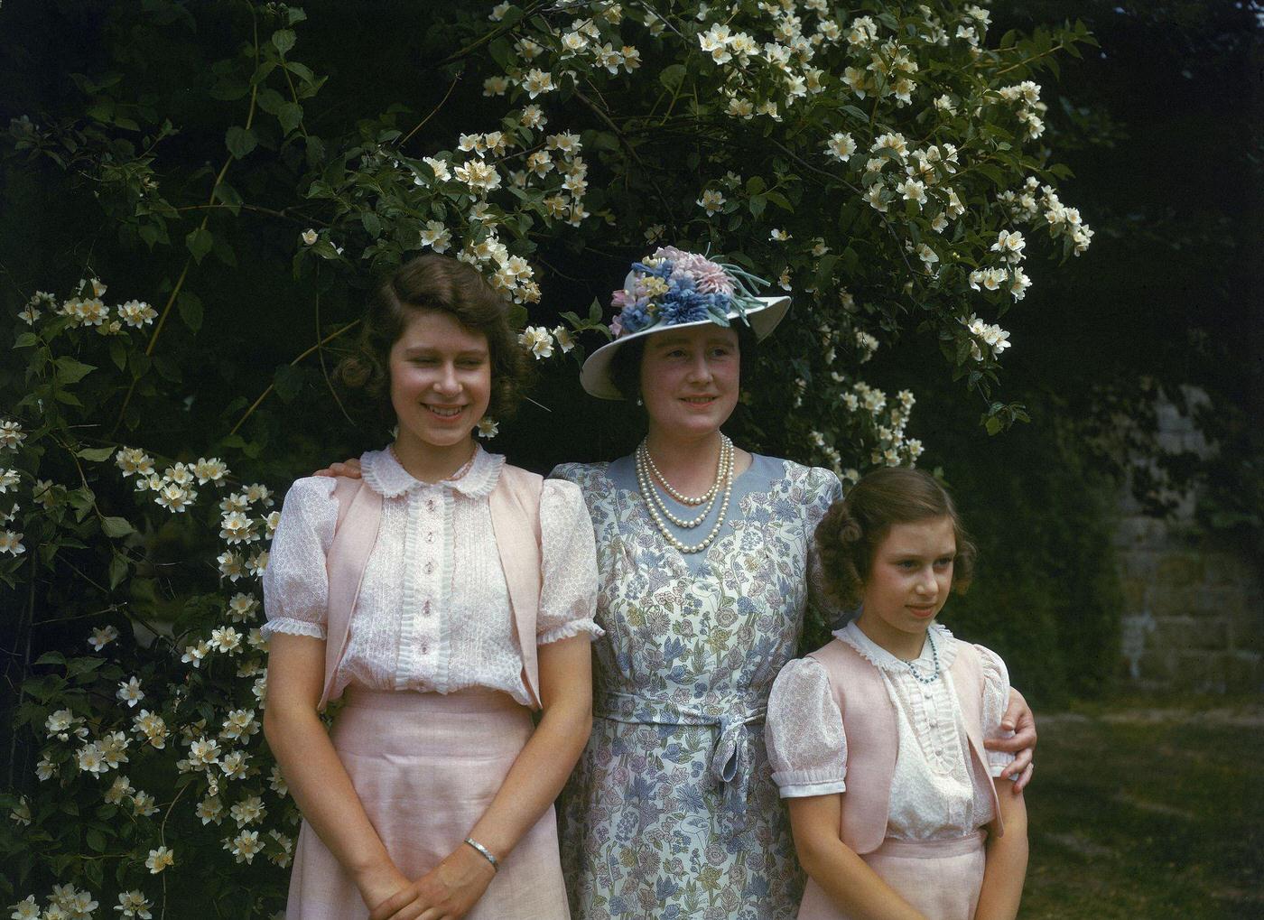 #52 The Queen Mother with Princess Margaret and Princess Elizabeth at Windsor Castle in England on 8 July 1941.