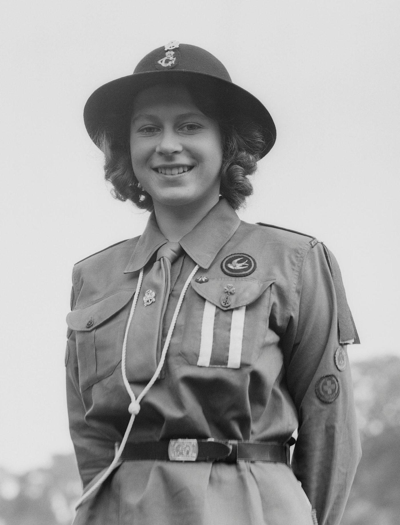 #63 Princess Elizabeth poses in her girl guide uniform in Frogmore, Windsor, England on April 11, 1942.