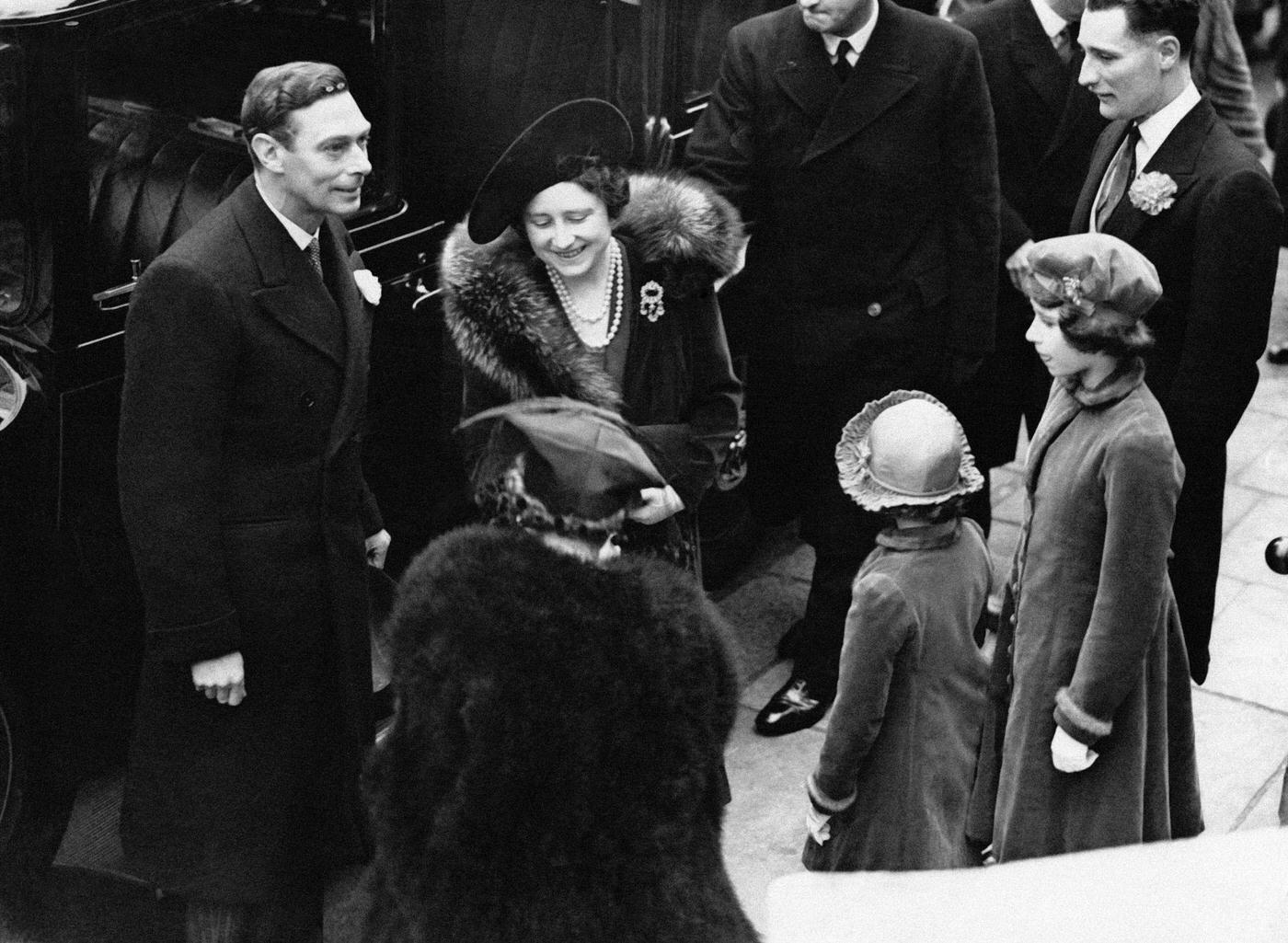 #9 King George VI and Queen Elizabeth arrive at the wedding of Cecilia Bowes-Lyon, a niece of the queen, and Kenneth Harington on March 8th, 1939 in London, UK.