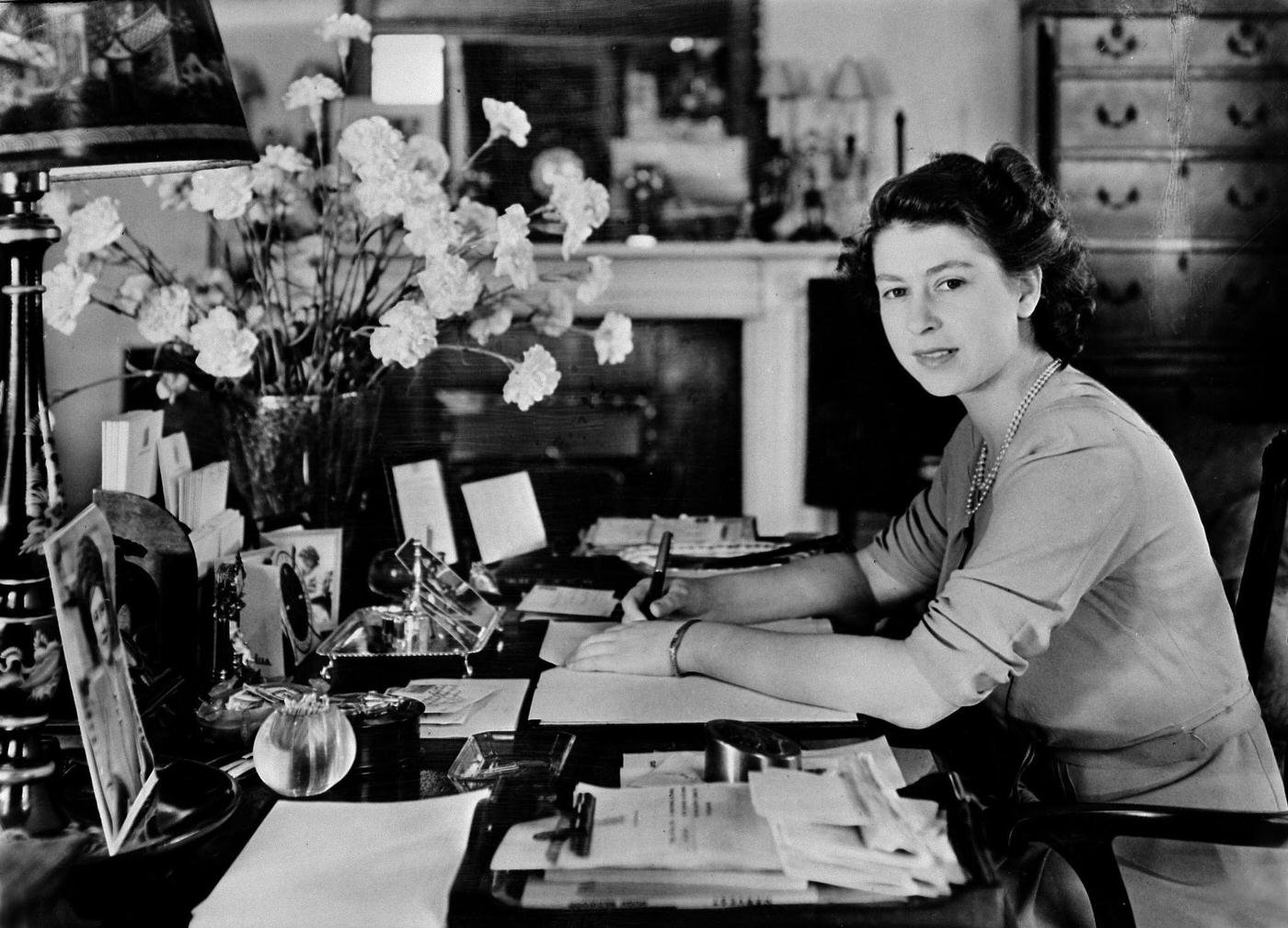 #92 Princess Elizabeth pictured at the desk in her sitting room at Buckingham Palace, London, England, circa 1947.