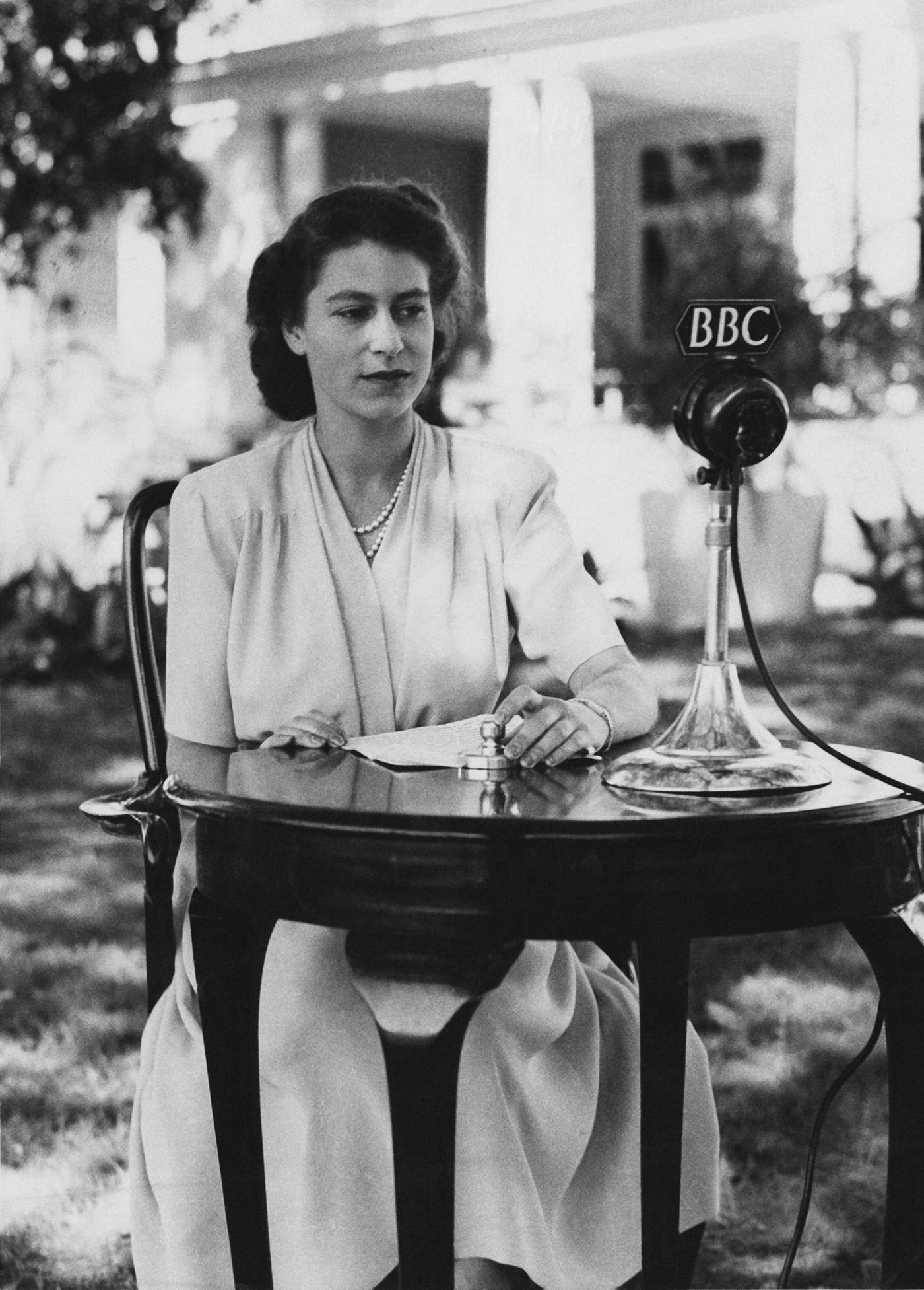 #96 Princess Elizabeth makes a broadcast from the gardens of Government House in Cape Town, South Africa, on the occasion of her 21st birthday, 21 April 1947.