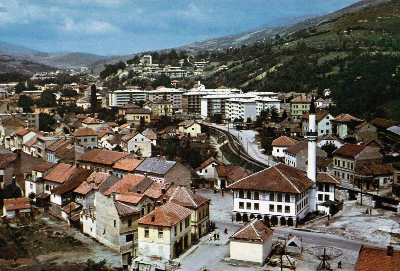 #54 The early 1960s view of Travnik from the east end with the narrow-gauge railway passing through town.