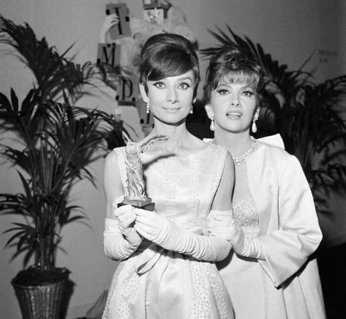#26 Audrey Hepburn and Gina Lollobrigida at the Marigny Theatre during the Nuit du Cinema in Paris, 1965