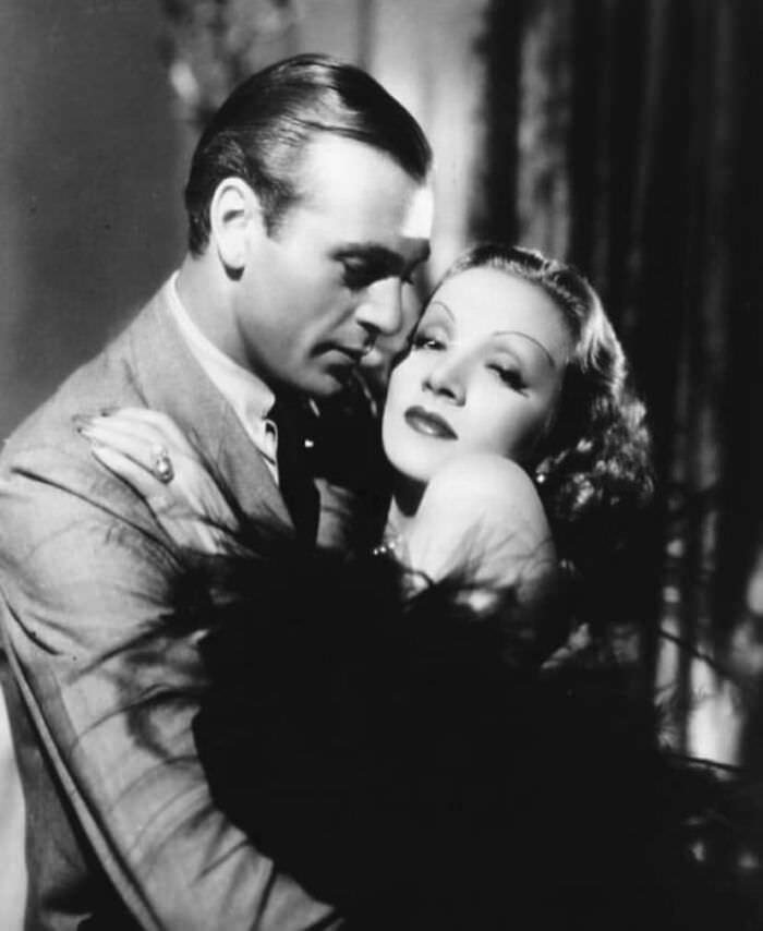 #97 Gary Cooper and Marlene Dietrich in a publicity photo for Desire, 1936
