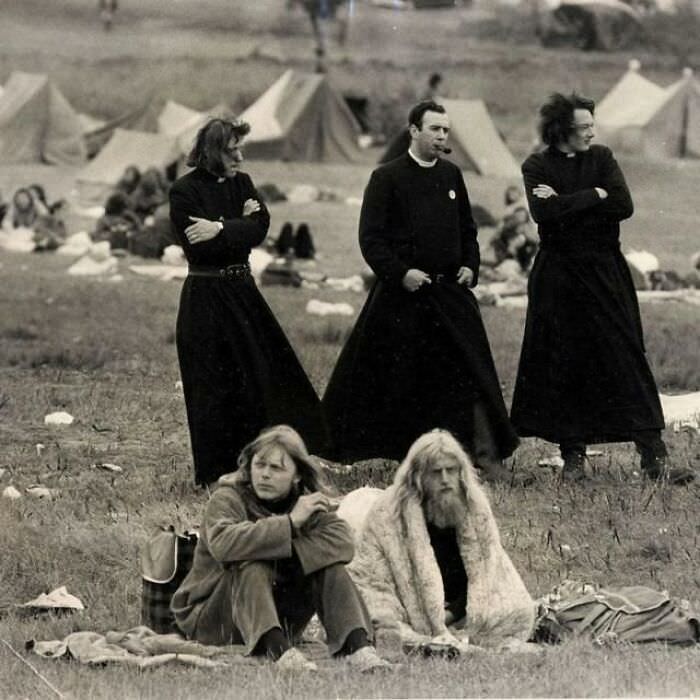 #98 Priests mingle with hippies at the Glastonbury Music Festival in 1971