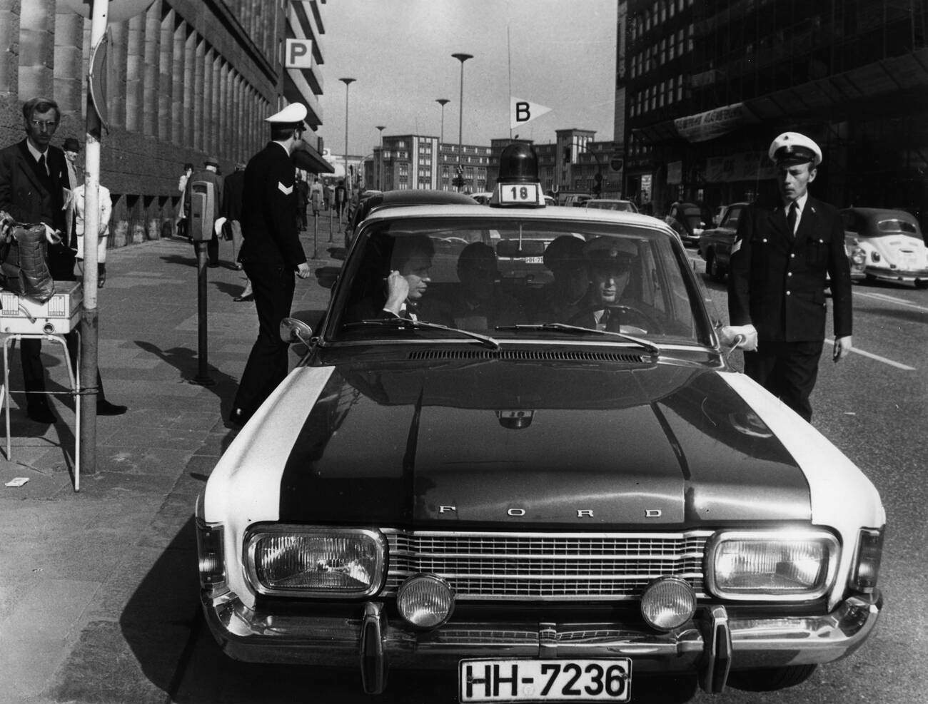 #49 Police patrol car in front of the finance office in Hamburg, Germany after a robbery on April 21, 1971.