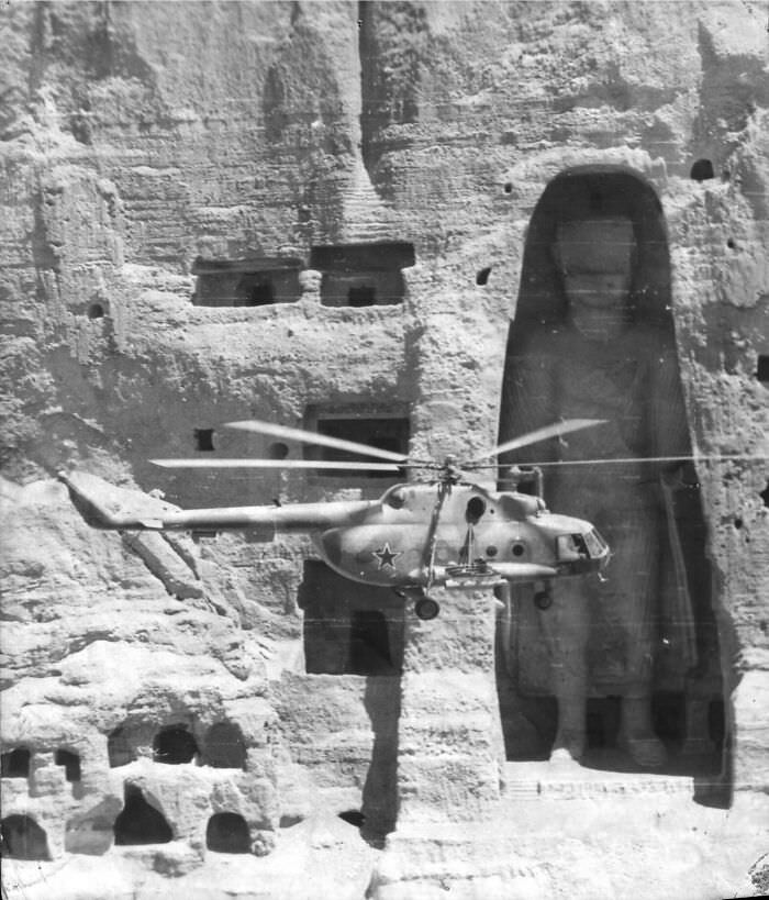 #116 Soviet helicopter flies past the Buddha of Bamiyan