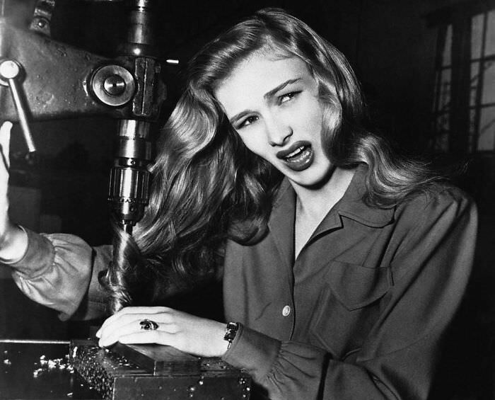#84 Veronica Lake demonstrates the dangers of long hair for women war workers, 1943