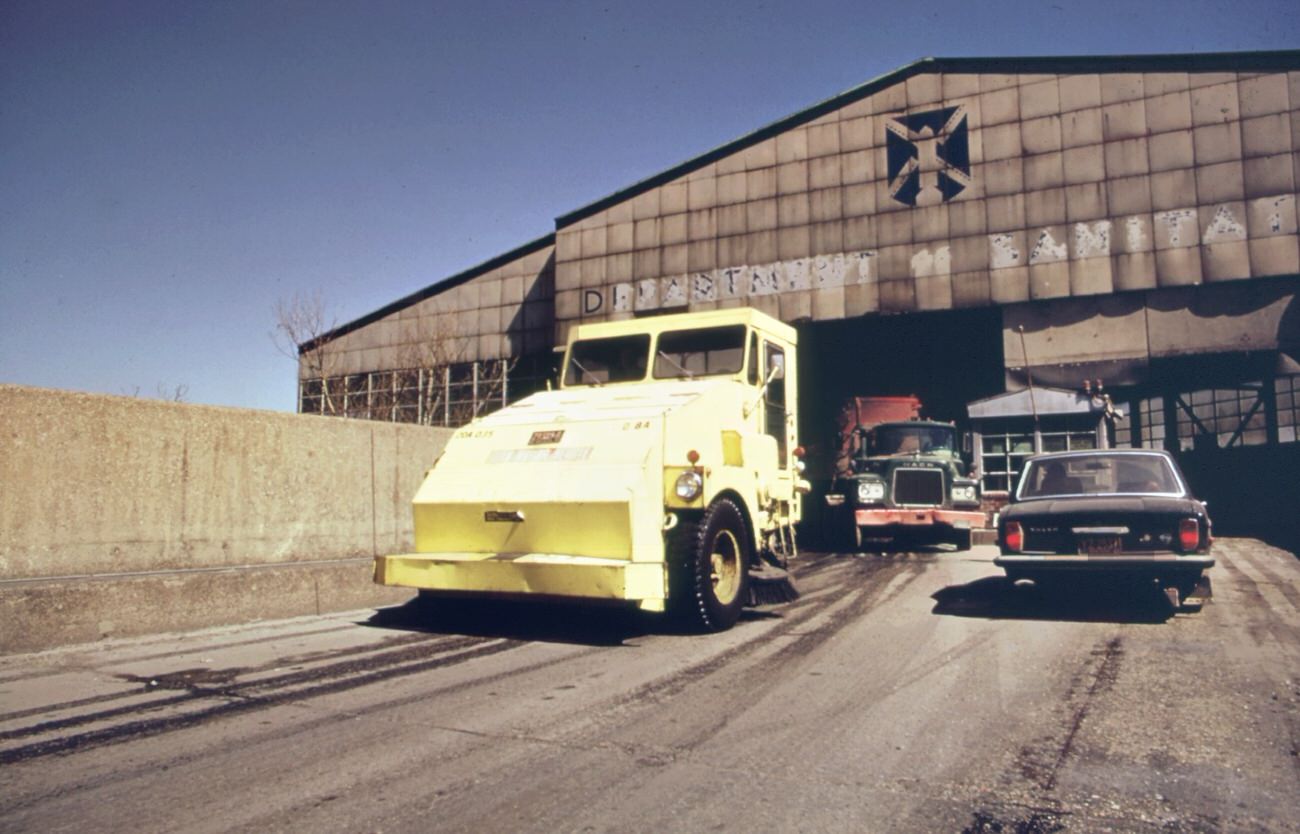 #107 Garbage truck at the 91st street marine transfer station (mts). From the mts, waste is carried by barge down the east river to the landfill dump on staten island, 1970s