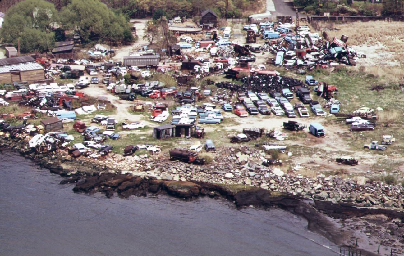#126 Auto wreckers and auto junk-yard on meridith avenue unwanted automobile bodies and parts are dumped into arthur kill, 1970s