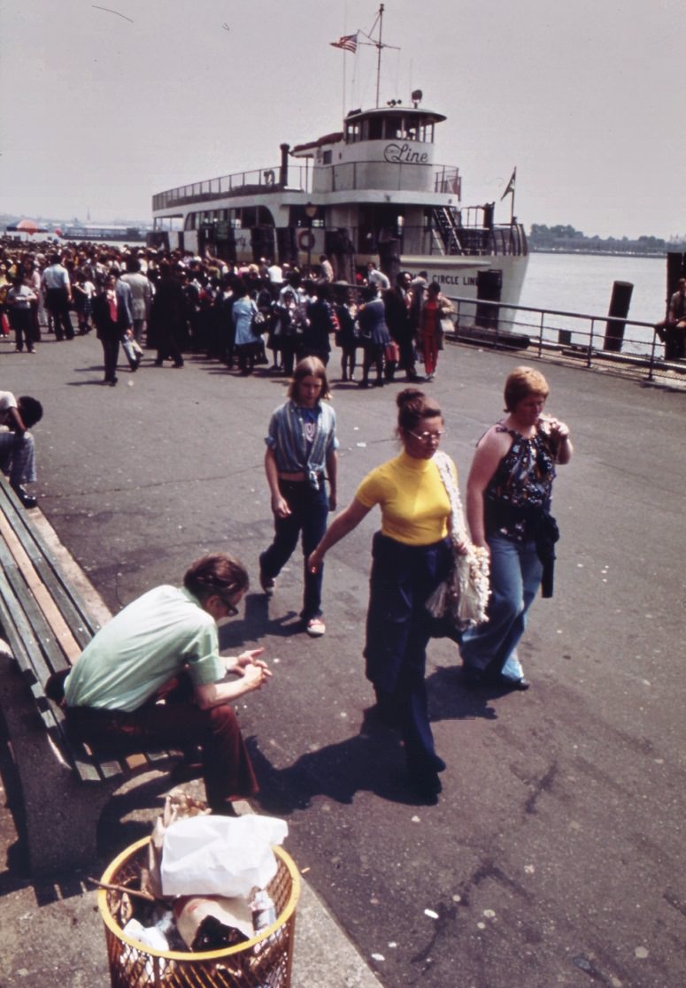 #25 Battery park waterfront, lower manhattan. Staten island ferry in background, 1970s