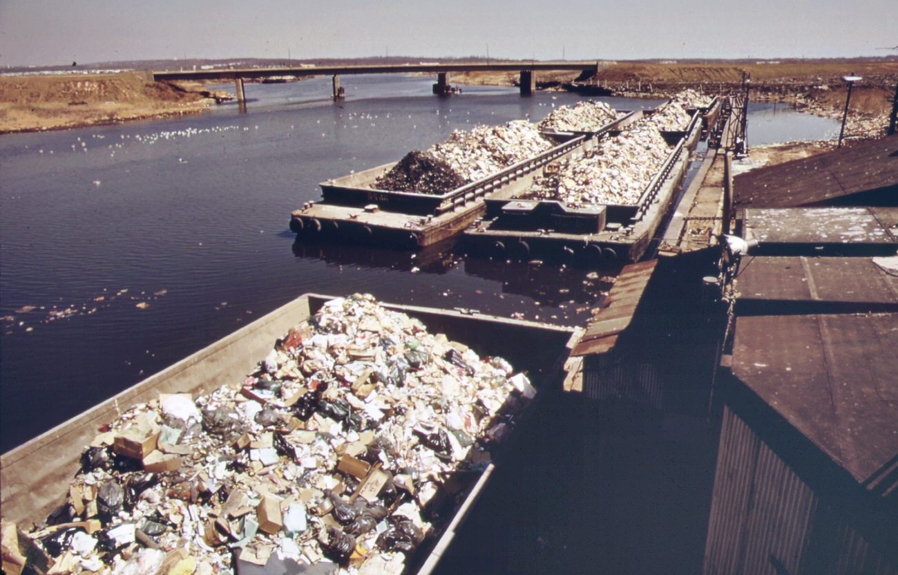 #51 Garbage scows from manhattan wait to be unloaded at the staten island landfill, 1970s
