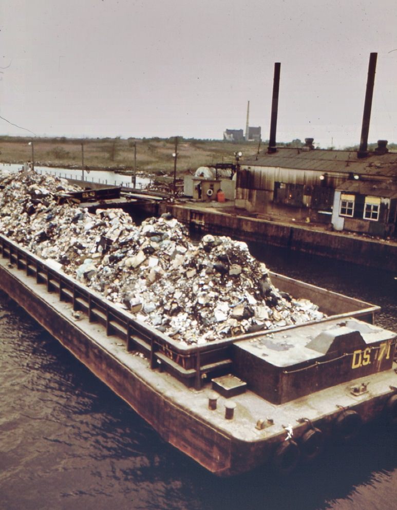 #75 Garbage scow at fresh kills on staten island, just east of carteret, nj. Waste will be used as landfill, 1970s