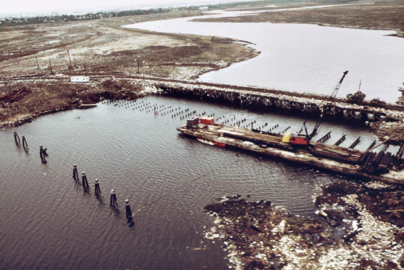 #76 Fresh kills on staten island, just east of carteret, ny. Solid waste brought in on barges covers all available land, 1970s