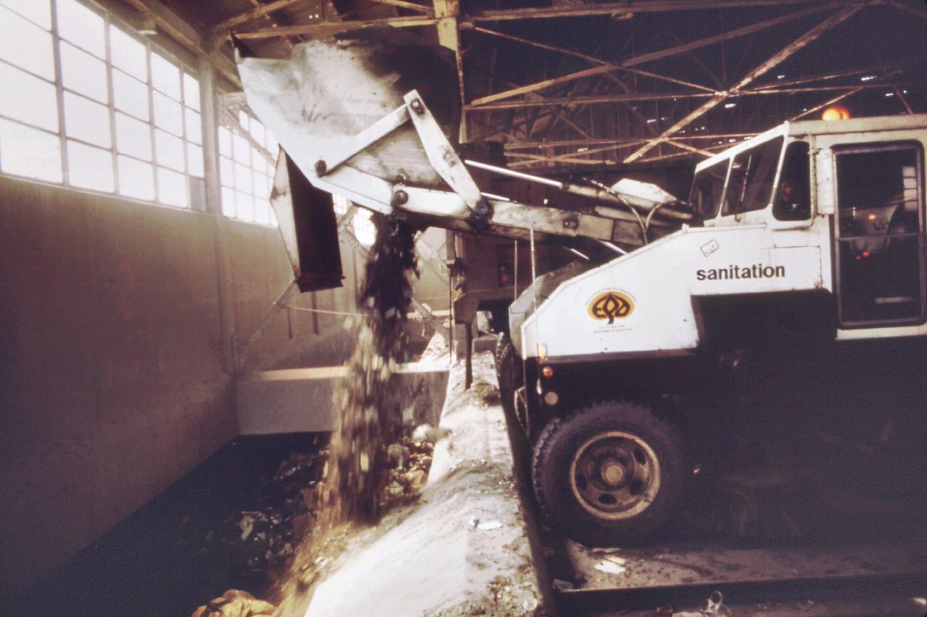 #88 Garbage trucks at 91st street marine transfer station. From this point, barges carry wastes down the east river to the staten island landfill, 1970s