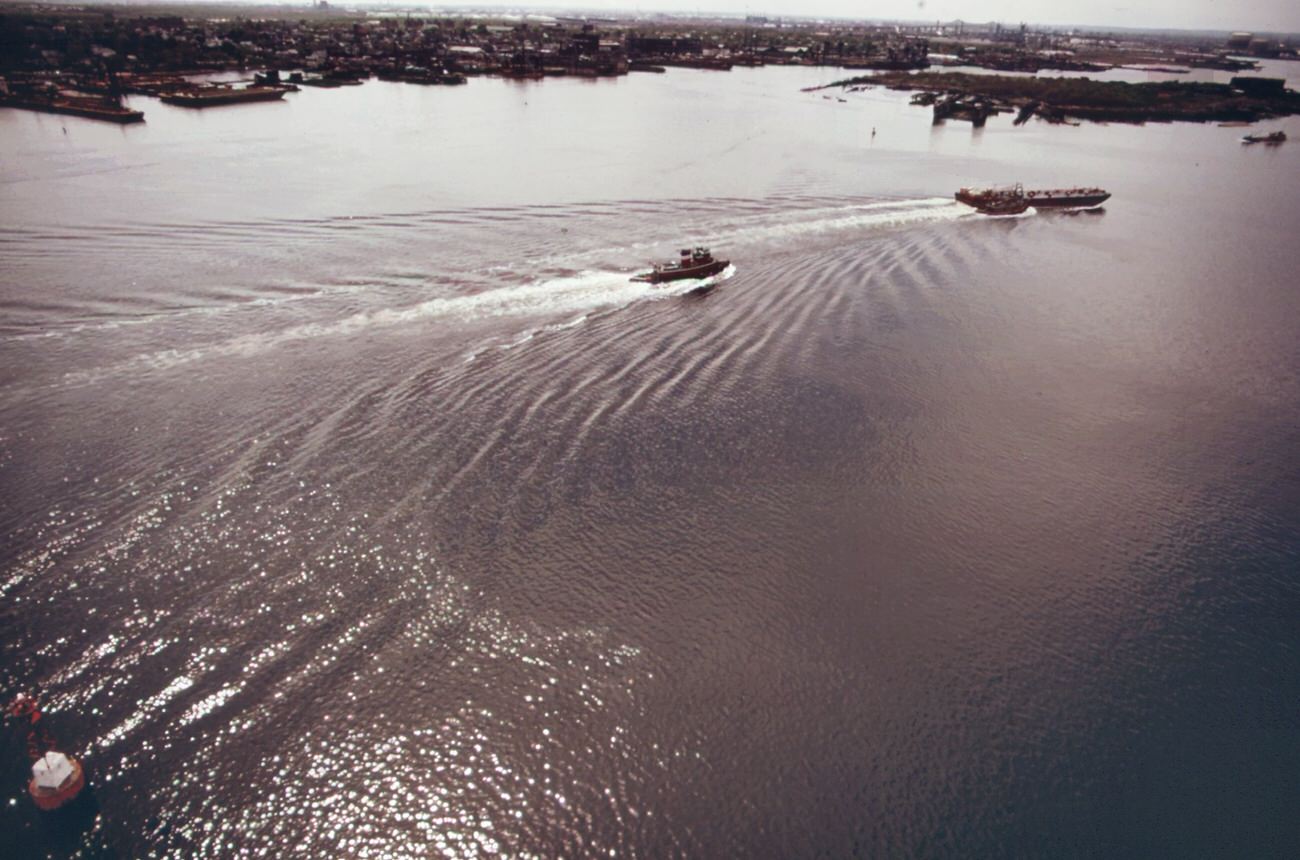 #90 The mouth of arthur kill, the waterway which separates new jersey and staten island. It is the site of a huge petrochemical manufacturing complex, 1970s