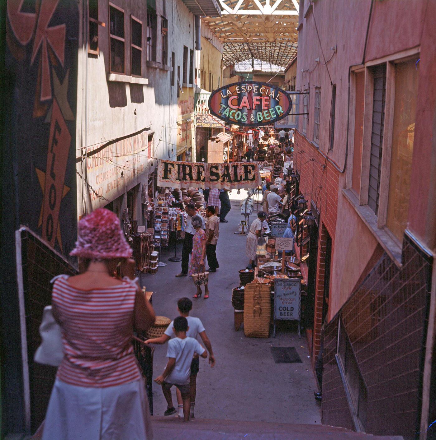 #4 View of a along a covered shopping arcade, Tijuana, Mexico, August 1963.