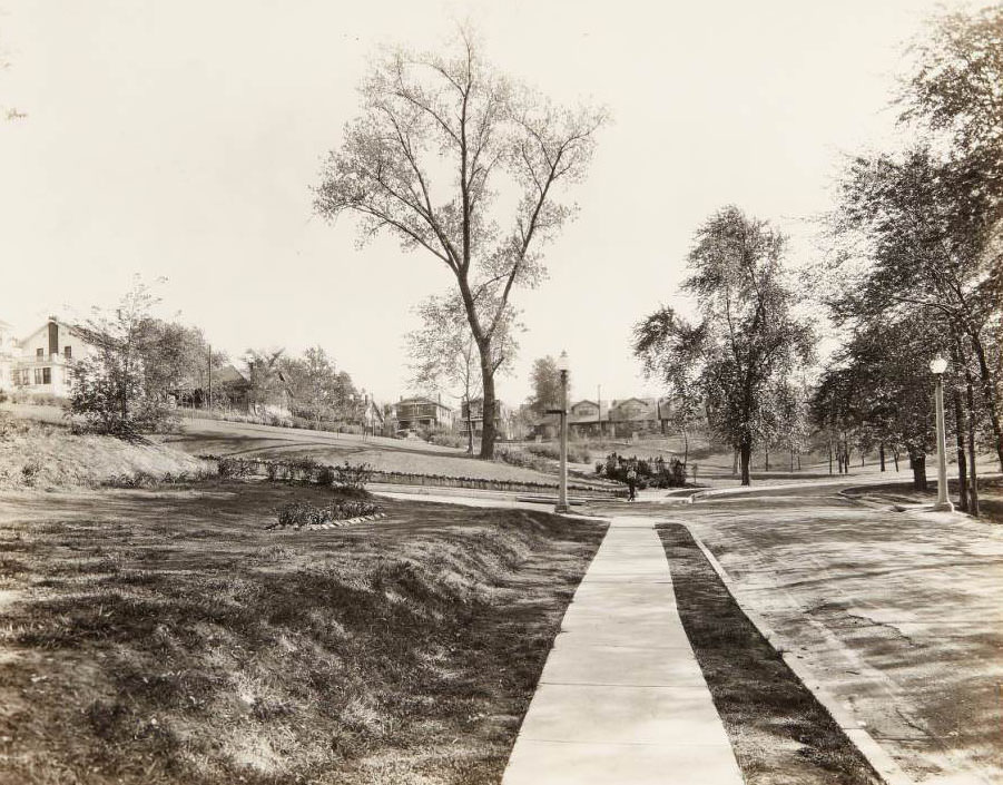 #7 Boy in rollerskates standing in a new addition to the Clifton Heights neighborhood, 1930