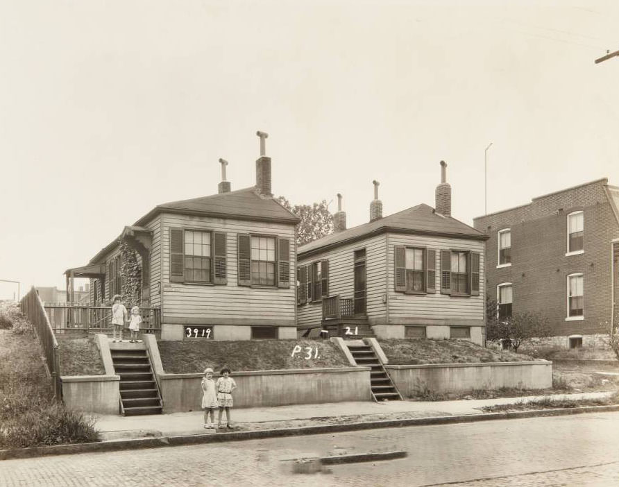 #14 Group of children standing in front of homes at 3919 and 3921 North Florissant Avenue, 1930