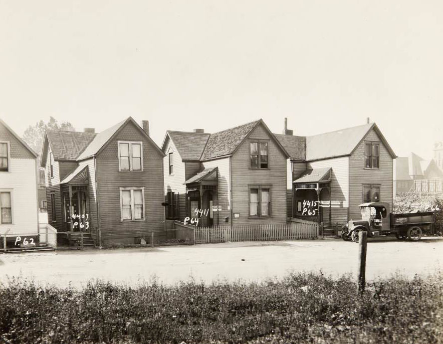 #45 Wood-sided homes on the 4400 block of N. Florissant Ave. at 4407, 4411, and 4415. J. Martin’s truck is parked in front of 4415, 1930