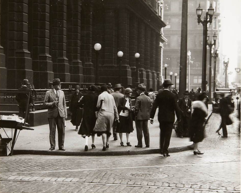 #33 Pedestrians crossing Olive St. at Ninth St. with the Old Post Office building visible in the background, 1930