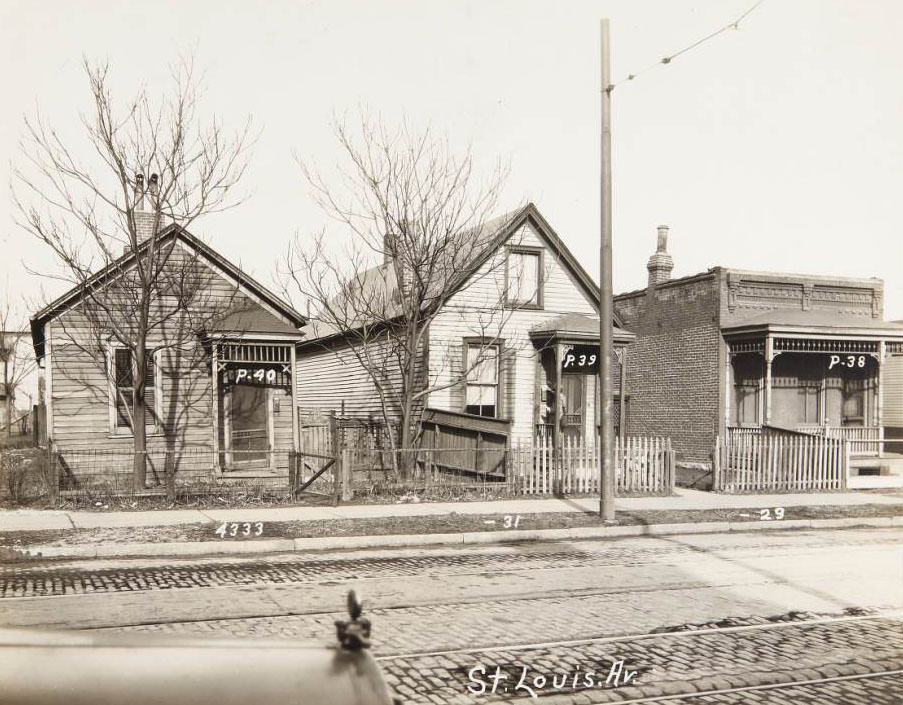#51 Three small houses at 4333-4329 St. Louis Ave. with a mailman delivering at 4331, 1930