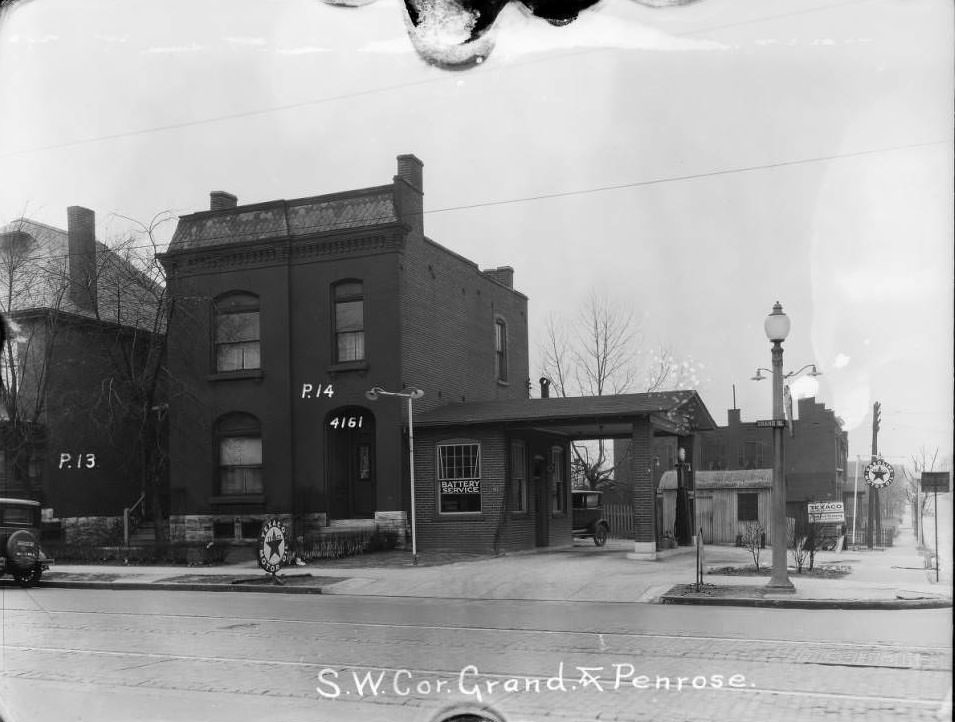 #63 N. Grand and Penrose, 1930 – View of southwest corner of Grand and Penrose. Walker Brothers auto repair garage.
