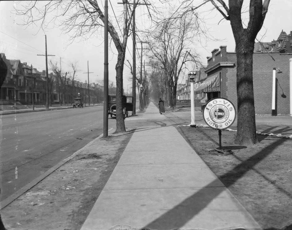 #74 View of sidewalk and residential street. Standard Oil filling station sign is visible. 4403 Laclede, 1930