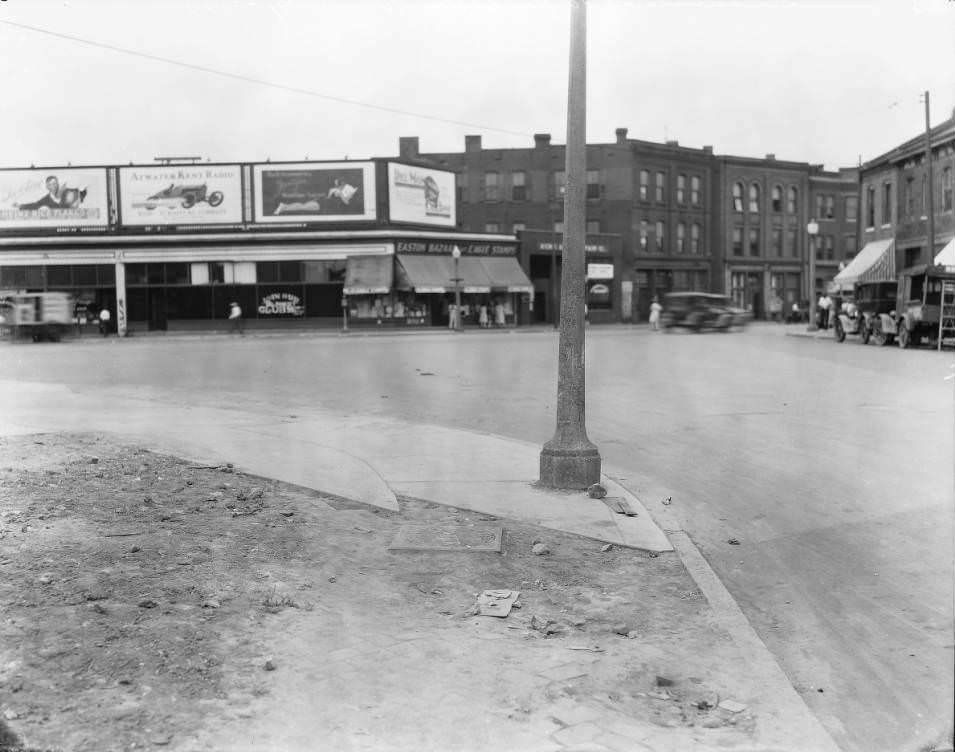 #77 Looking west from Thomas St., Easton Ave., and N. Compton Ave. intersection. Filling station and Easton Bazaar are visible, 1930