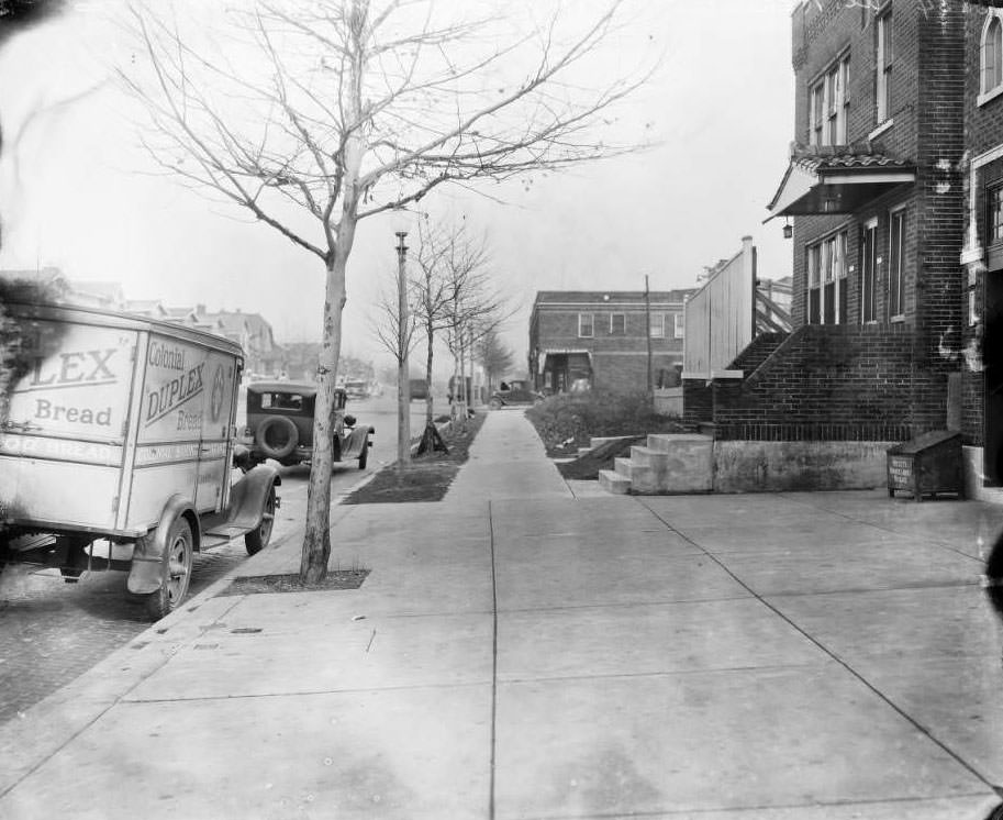 #126 View looking north down Grand Ave. from northeast corner of South Grand Blvd. and Fillmore St. with various buildings visible, 1930