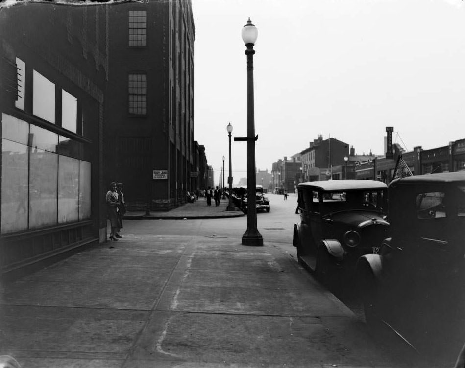 #127 Intersection at Morgan (now Delmar and 17th St. with signage for Hecht-Lears Clothing Manufacturers and various other businesses visible, 1930