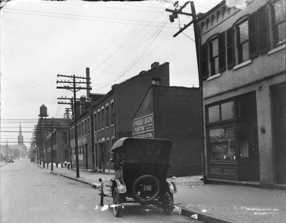 #143 View north on 13th Street from Cass Ave. Six-story Robert, Johnson & Rand Shoe Co. building and Independent Evangelical Protestant Church are visible, 1930