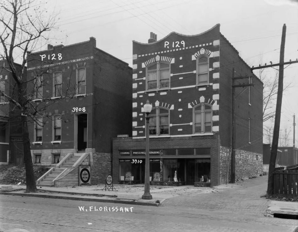 #151 View of two buildings on the 3900 block of West Florissant which housed a laundry and hat shop respectively, 1930