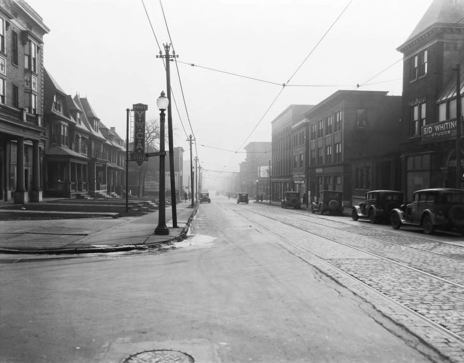 #157 View east down Olive Street at the intersection with Pendleton Ave. Y.W.C.A. Hotel and Cafeteria and Sid Whiting Studios are visible, 1930