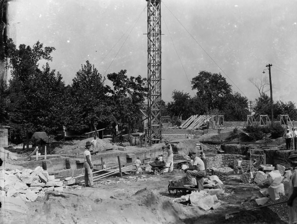 #165 View of several construction workers on a large building site, 1930