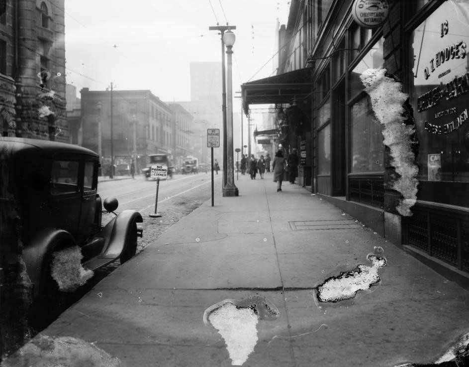 #167 Downtown sidewalk view including O. T. Hodges Chile Con Carne and Hot Tamale Restaurant at 18 South 18th Street, 1930