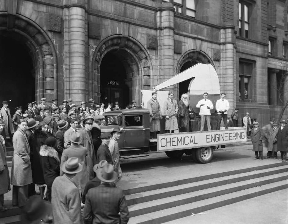 #181 A truck and five men decorated for a parade with a Chemical Engineering sign parked in front of St. Louis City Hall, 1930