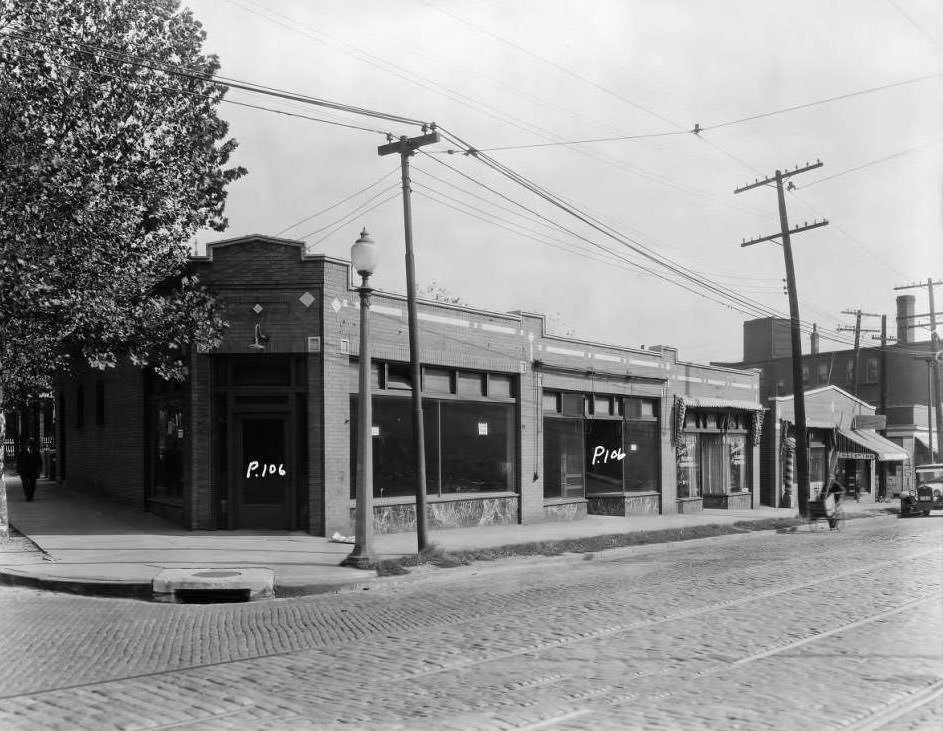 #14 View of northeast corner of W. Florissant and Obear Ave., with the Nancy Shoppe tailor storefront visible, 1931