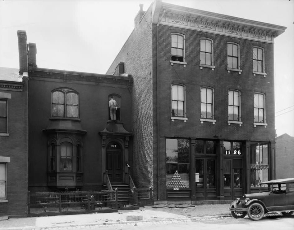#17 View of 1122-1126 Monroe near 12th, with a grocery store on the first floor of the three-story corner building, 1931